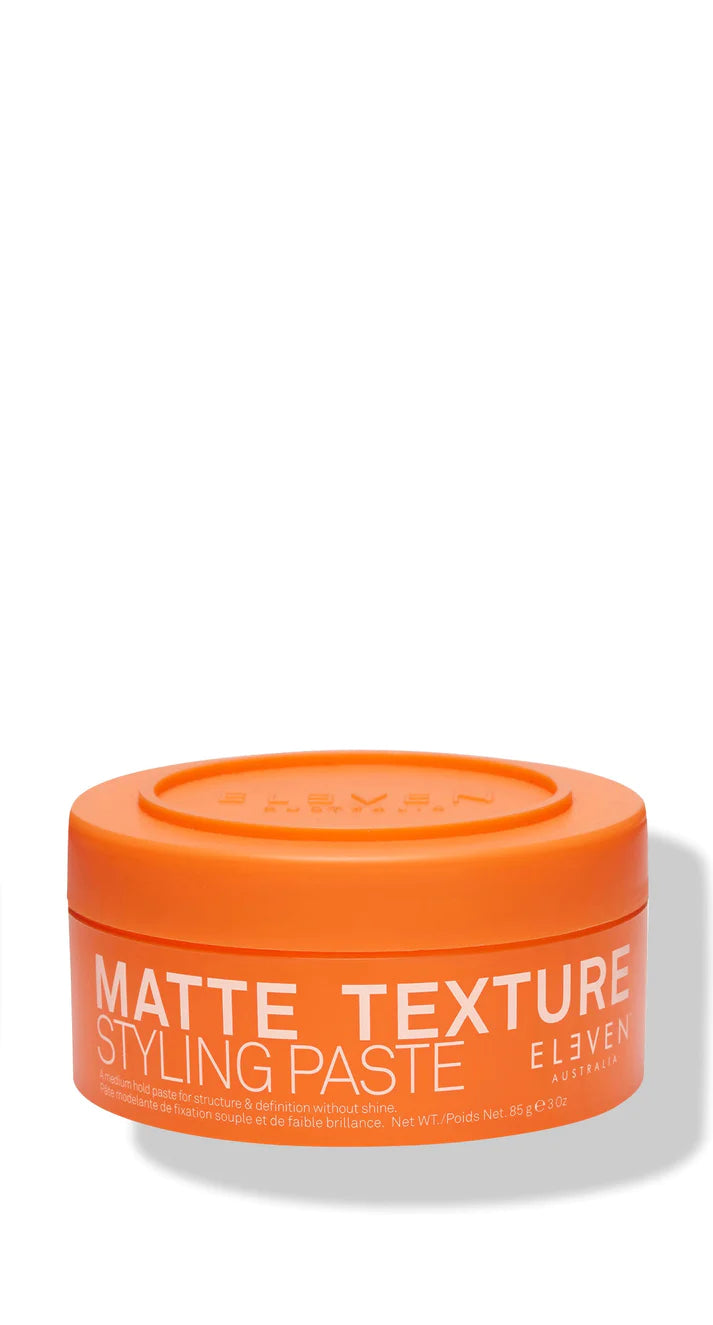 A orange container of Matte Texture Styling Paste by ELEVEN