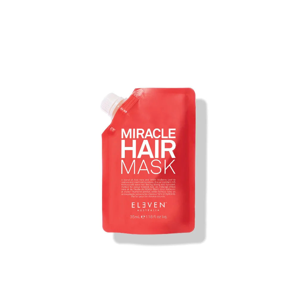 A red pouch of 'Miracle Hair Mask' by ELEVEN, with the brand's logo and product details visible on the packaging.
