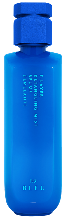 A blue bottle labeled 'F-Layer Detangling Mist' by R+Co BLEU.