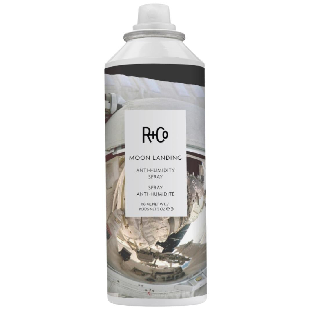 White can of R+Co Moon Landing Anti-Humidity Spray hair product with space suit image on label