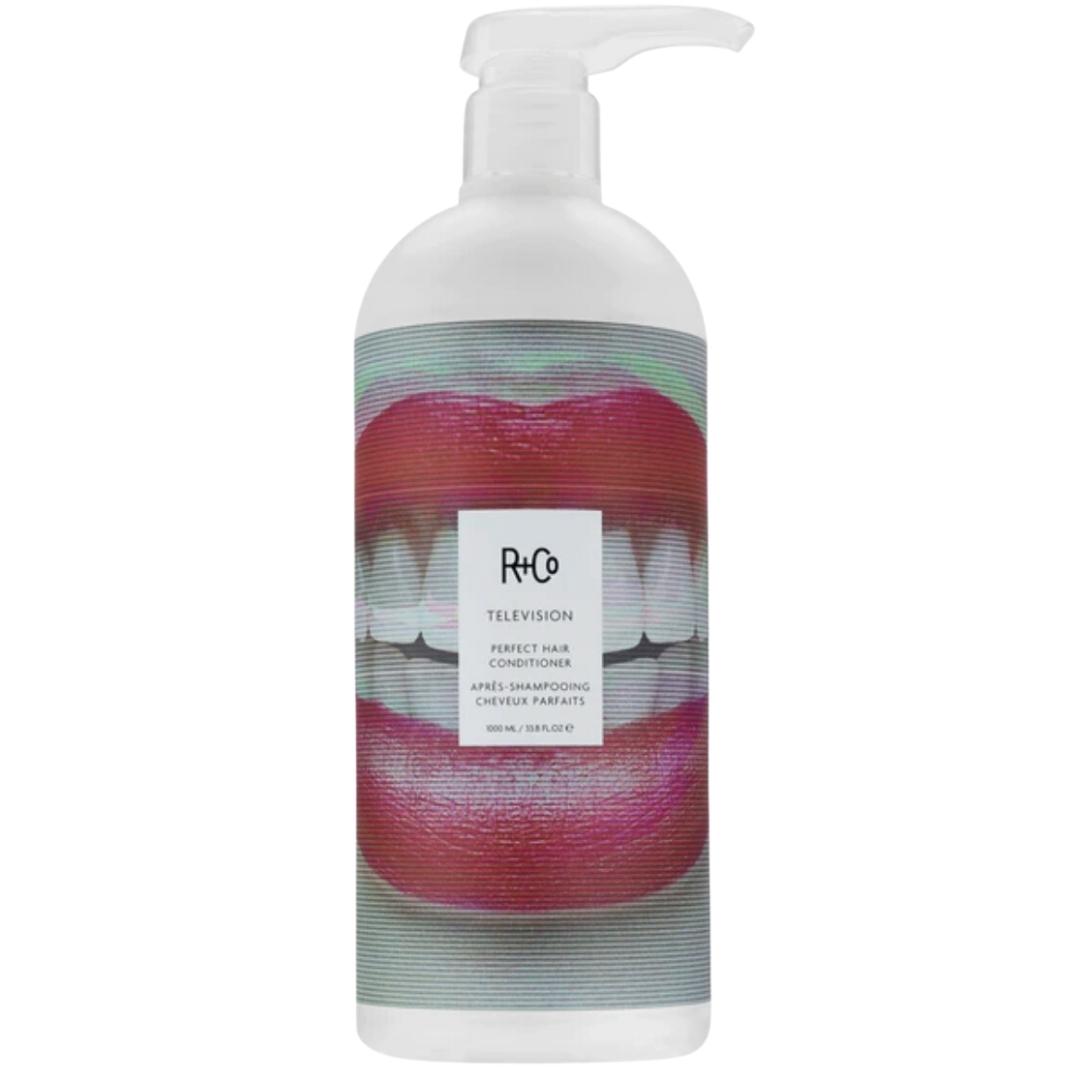 Pump bottle of R+Co Television Perfect Hair Conditioner with smiling mouth image