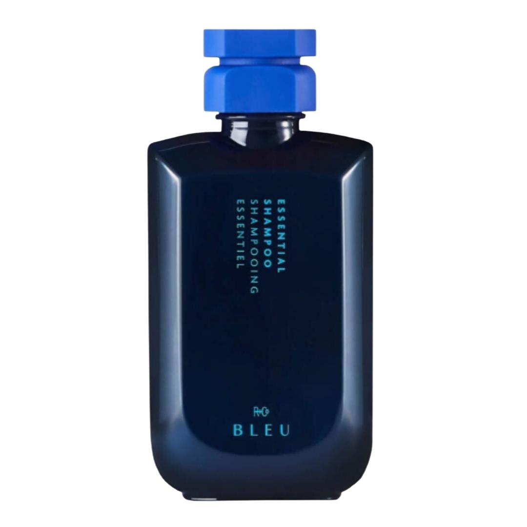 Blue bottle of R+Co Bleu Essential Shampoo hair product with light blue cap