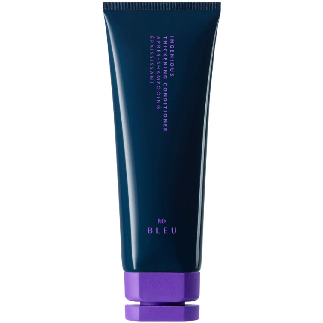 Tube of R+Co Blue brand Ingenious thickening conditioner with a purple cap