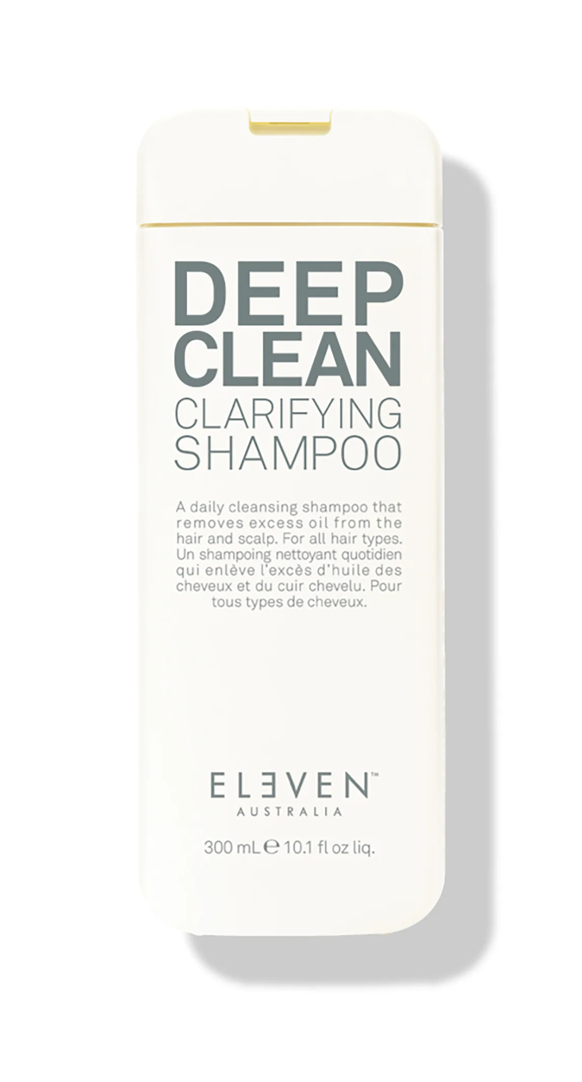 A bottle of ELEVEN brand Deep Clean Shampoo with text highlighting its clarifying properties.