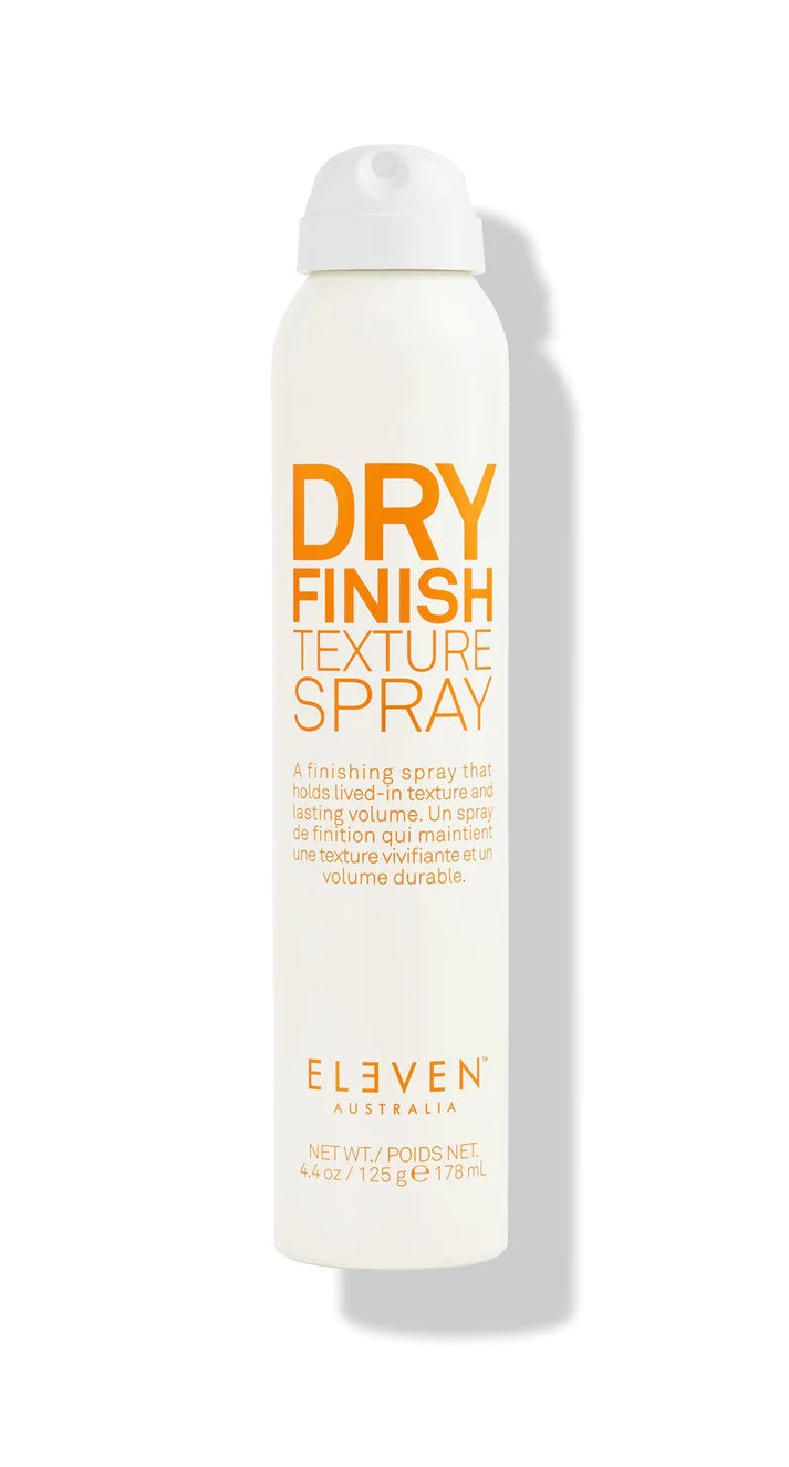 A white aerosol spray can labeled 'Dry Finish Texture Spray' by ELEVEN.