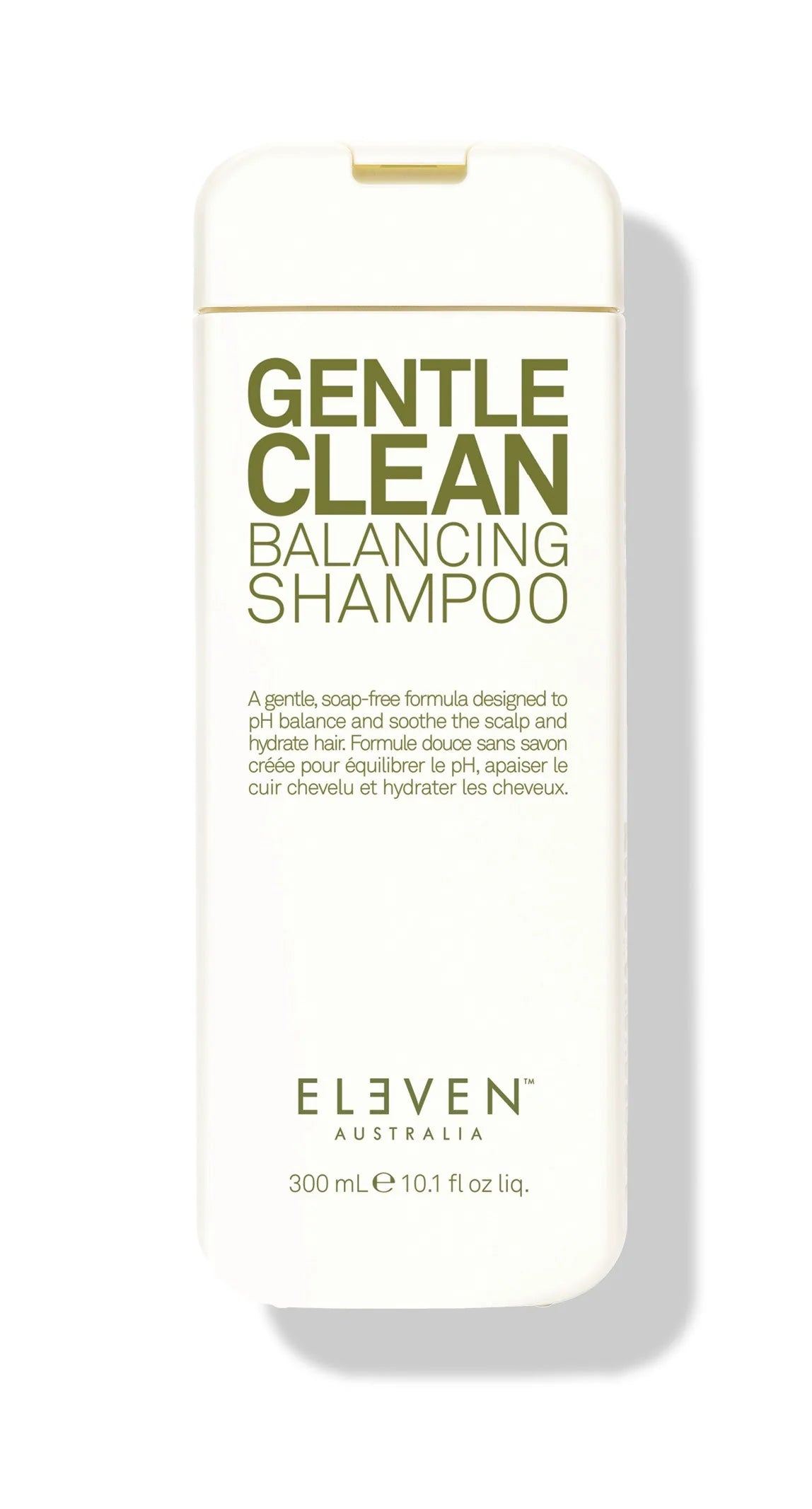 A bottle of ELEVEN Gentle Clean Balancing Shampoo with a white and green label.