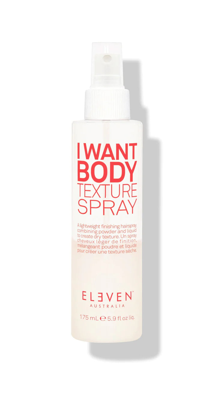 White spray bottle of I Want Body Texture Spray by ELEVEN Haircare, a styling product for adding texture to fine to medium hair.