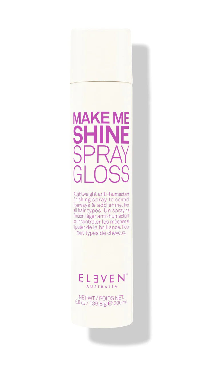 A white can of 'Make Me Shine Spray Gloss' by ELEVEN with purple text