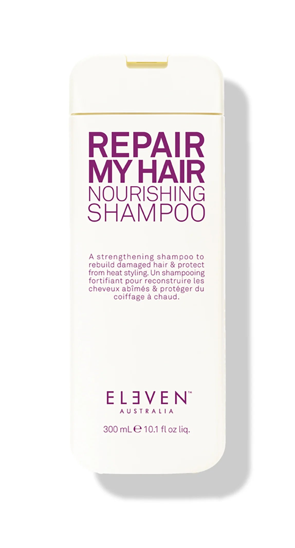 A bottle of ELEVEN brand 'Repair My Hair Nourishing Shampoo', which is a strengthening shampoo for damaged hair, with purple and white packaging.