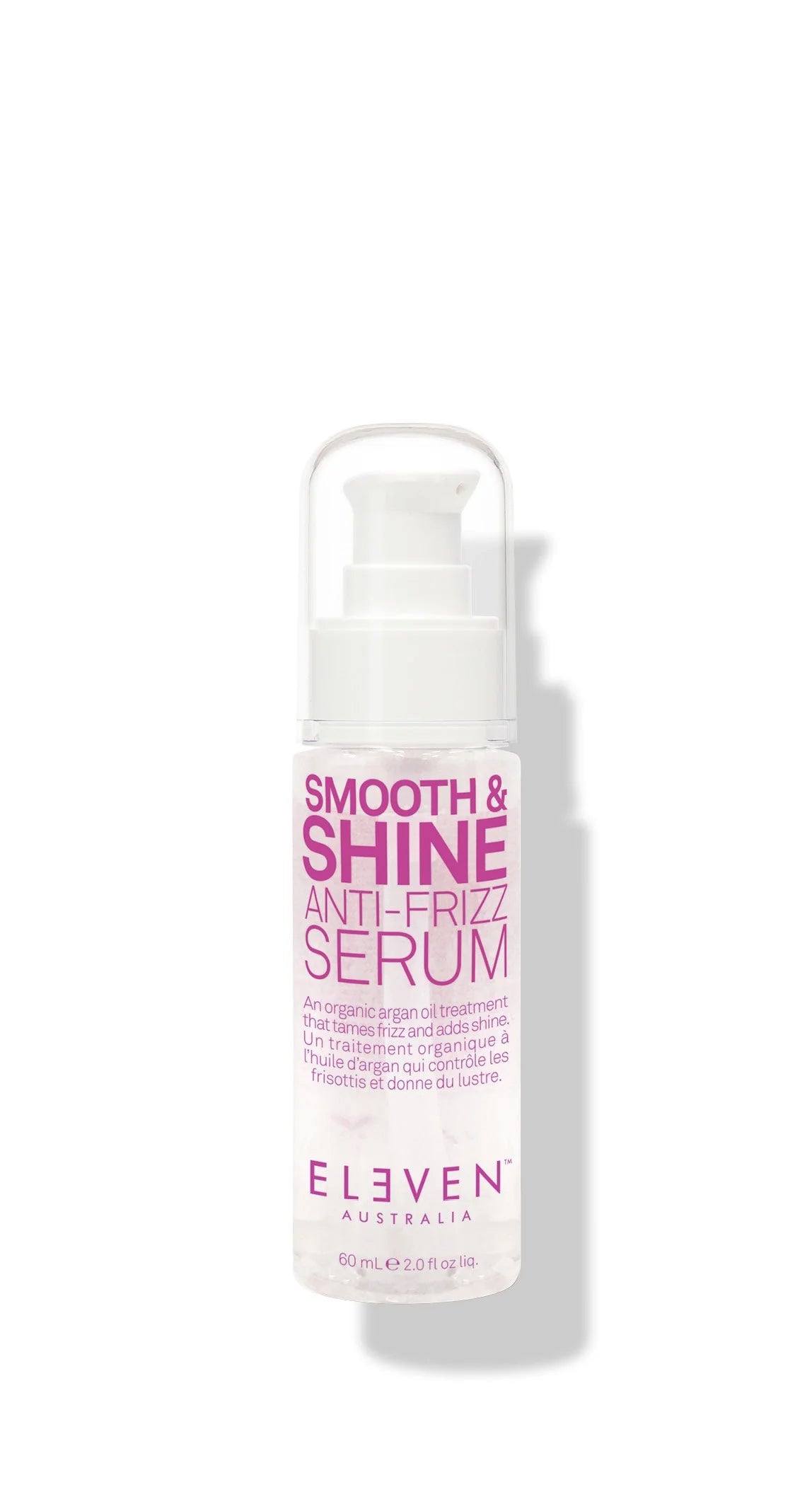 A pump bottle of Smooth and Shine Anti-Frizz Serum by ELEVEN with a white and pink label.