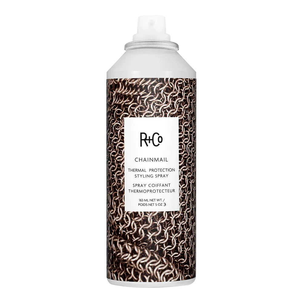 A can of R+CO Chainmail thermal protection spray with a black and white chainmail design.