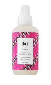 R+Co Zipper hair product bottle with pink and black pattern on a white background