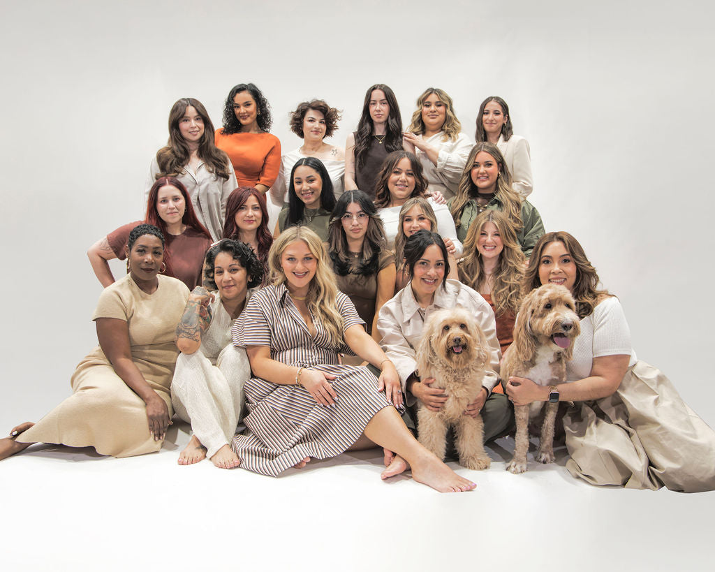 Group photo of the entire Revel Workshop team against white background