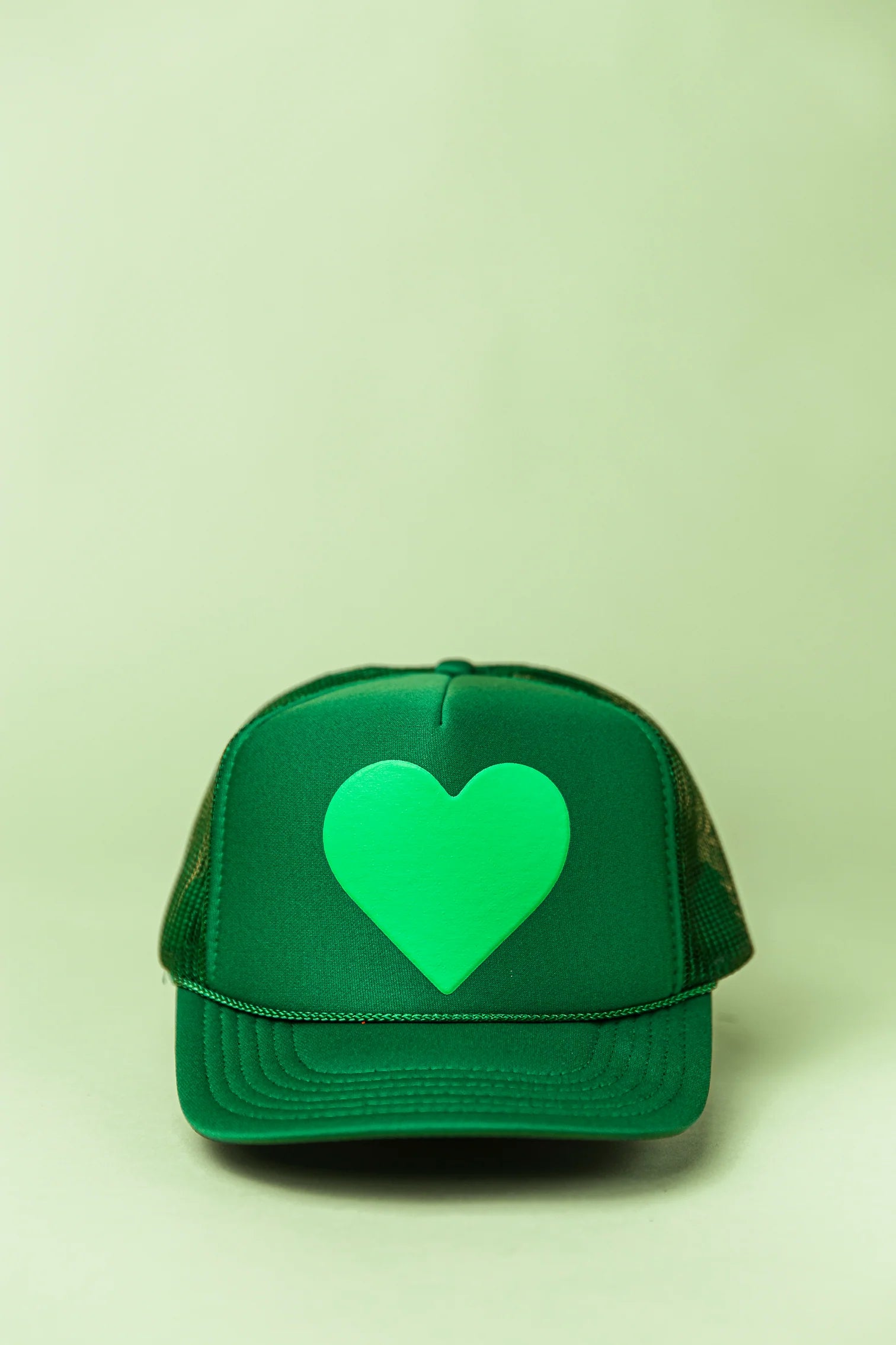 Green trucker hat with light green heart on the front