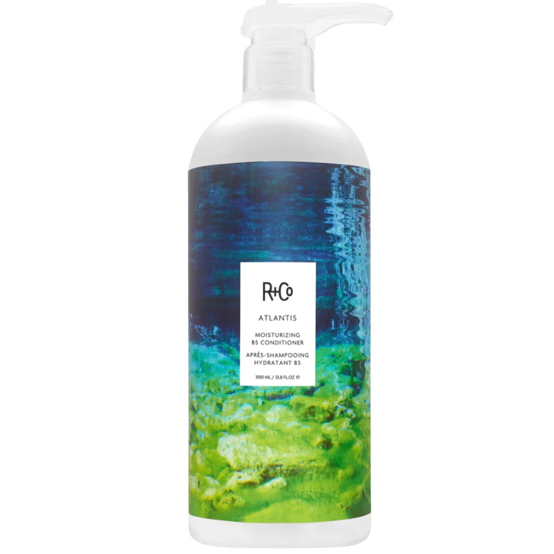 Bottle of R+Co ATLANTIS Moisturizing B5 Conditioner hair product with blue and green label