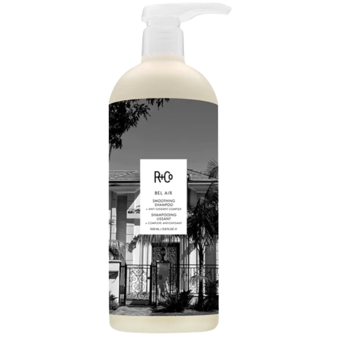 Bottle of R+Co Bel Air Smoothing Shampoo with black and white label design