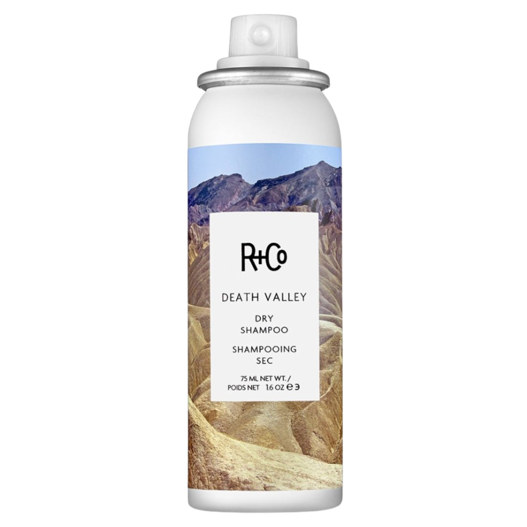 A can of Death Valley Dry Shampoo by R+Co with a mountainous landscape design.