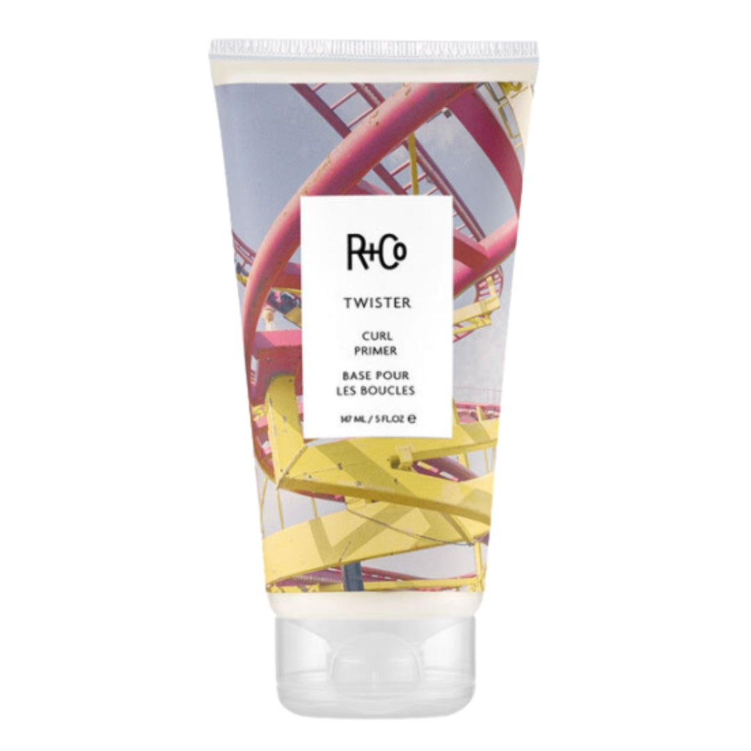 Container of R+Co Twister Curl Primer hair product with rollercoaster image on label