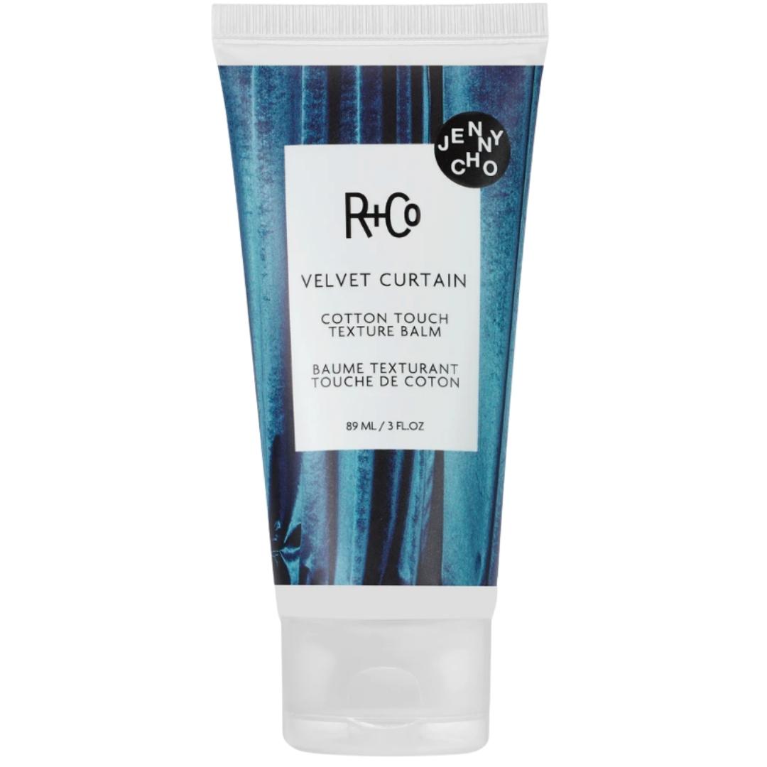 White tube of R+Co Velvet Curtain Cotton Touch Texture Balm hair product
