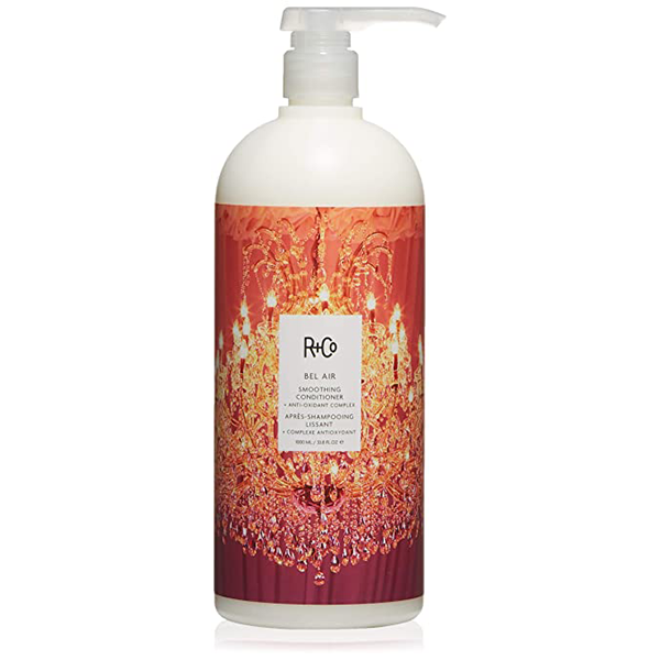 White bottle of R+Co Bel Air Smoothing Conditioner with a chandelier image in the label