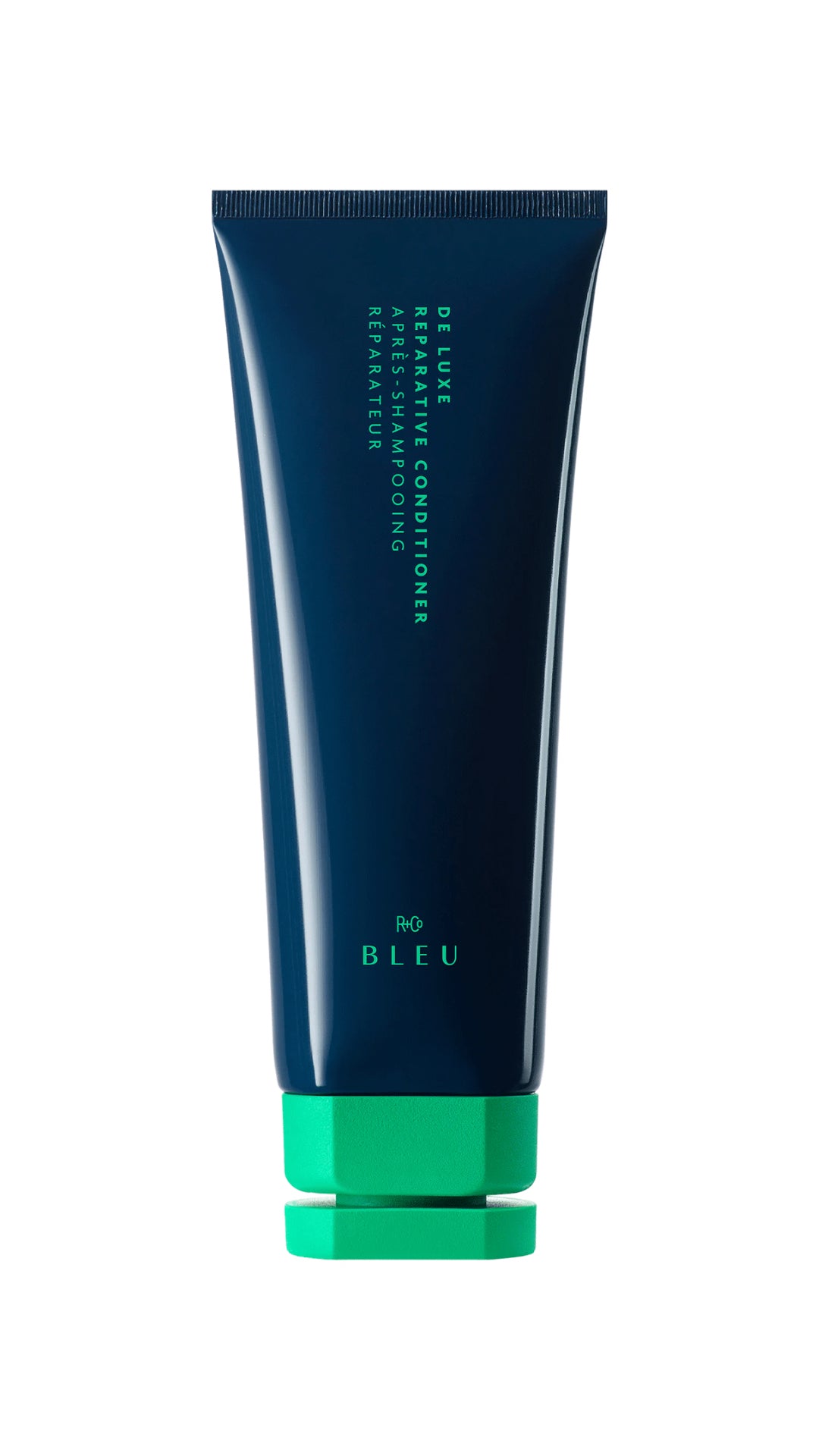 Dark blue tube with green cap; R+Co Bleu De Luxe Reparative Conditioner