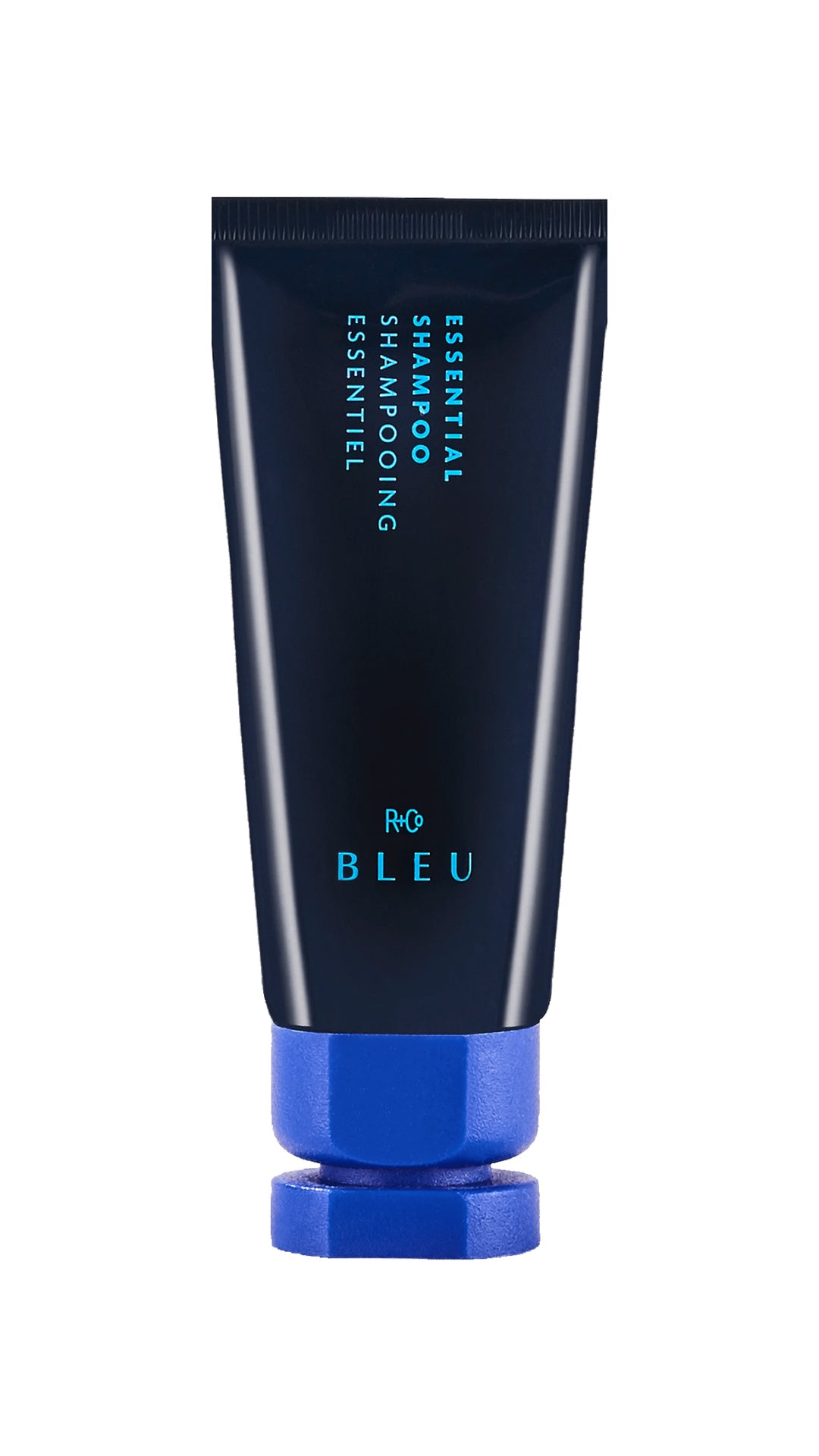 Blue container of R+Co Bleu Essential Shampoo hair product with light blue cap