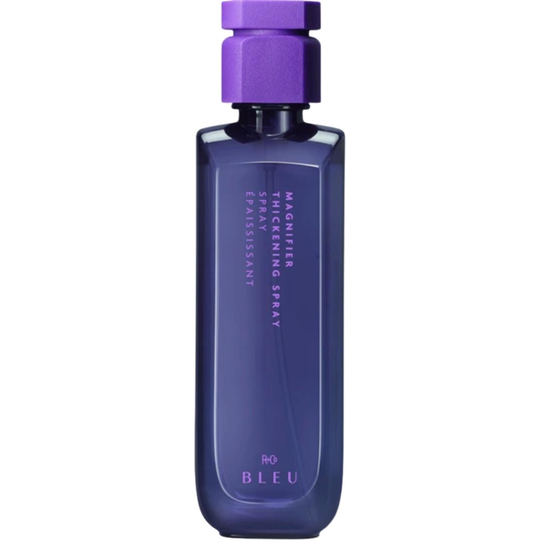 Purple container of R+Co Bleu Magnifier Thickening Spray hair prouct